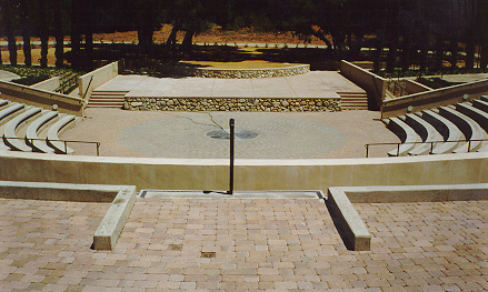 Center stage from rearmost seating. Note the floor of the theater is cobbled, with a drain.